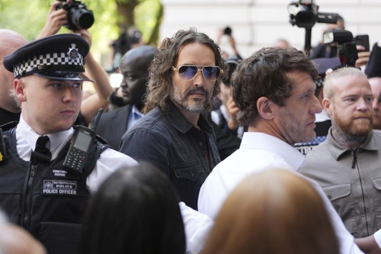Russell Brand arrives at London court to face sexual assault charges